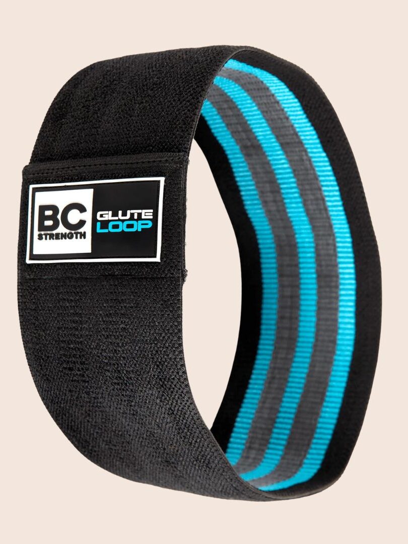 A black and blue resistance band labeled "BC Strength Glute Loop," perfect for exercise and strength training. Ideal for pairing with massage guns to enhance recovery and performance.