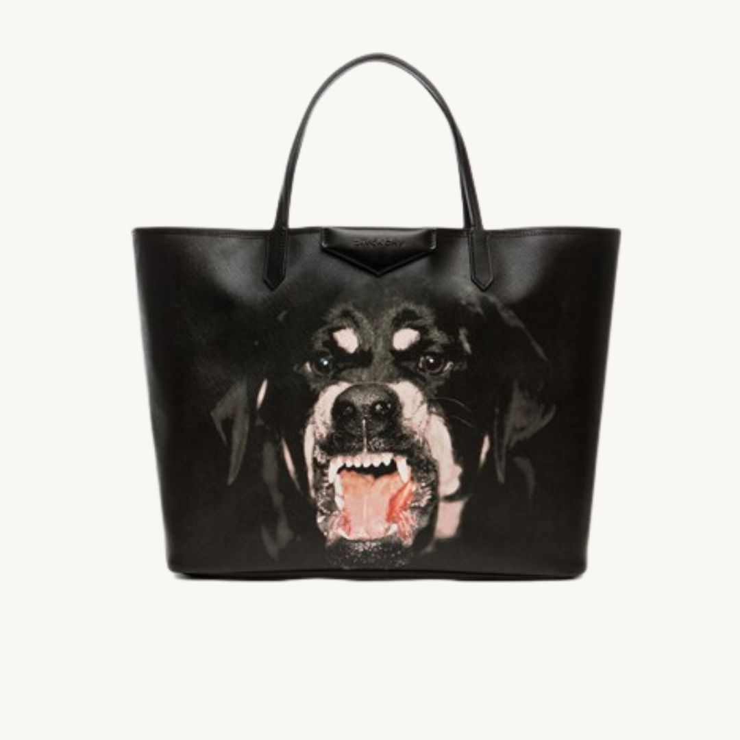 A black tote bag with an image of a snarling dog's face showing teeth and gums prominently.