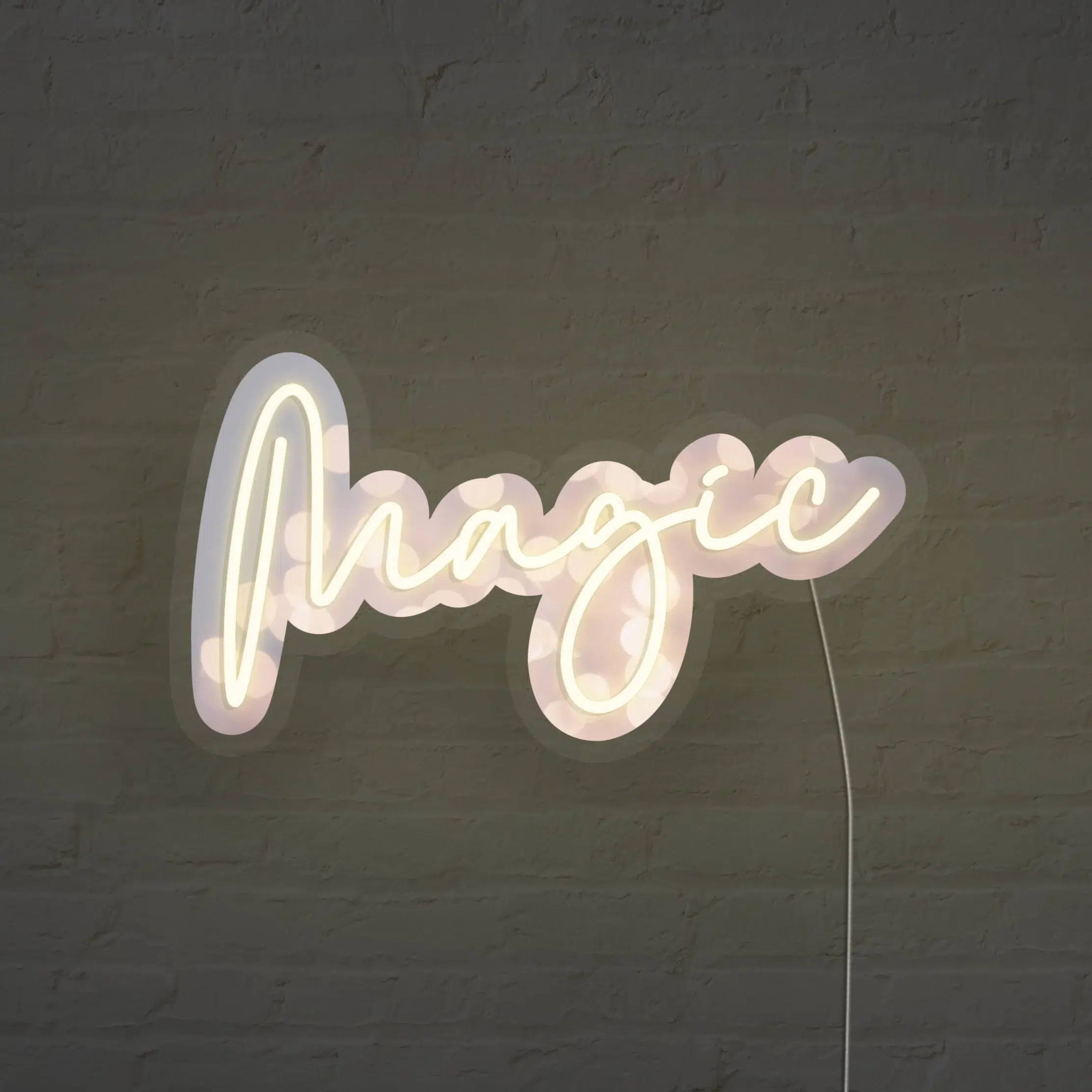 A neon sign spelling the word "magic" is mounted on a dark brick wall.