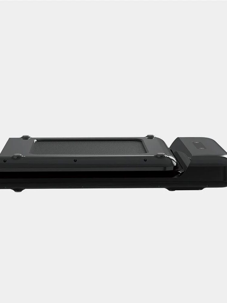 A sleek black treadmill stands on a white background.